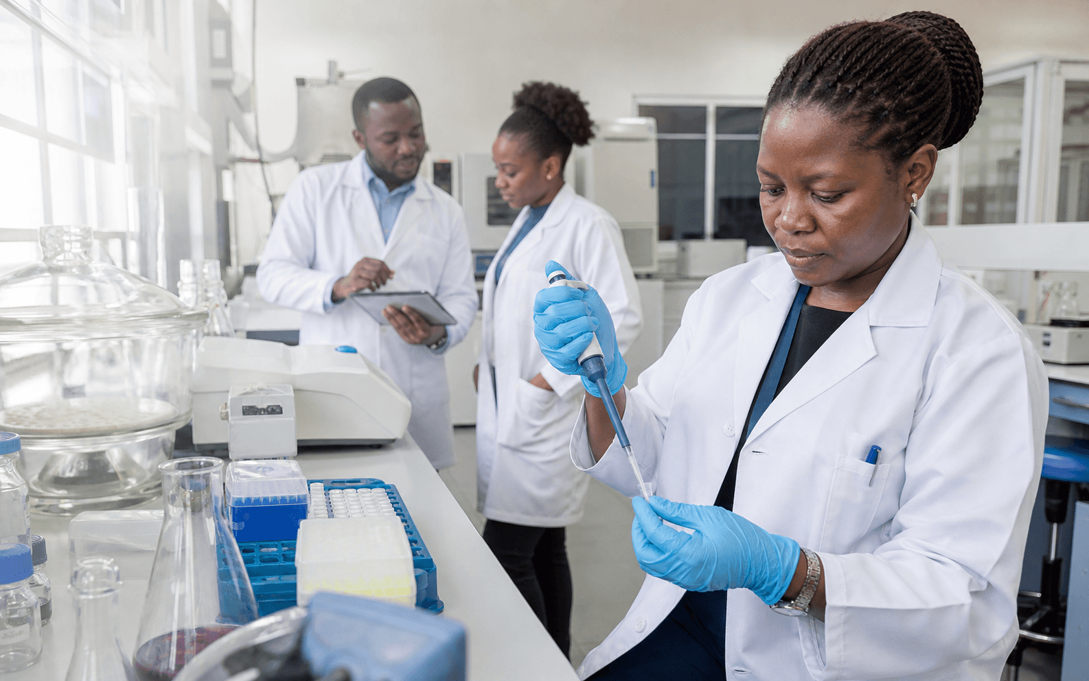 African pharmaceutical scientists working together in a modern research laboratory